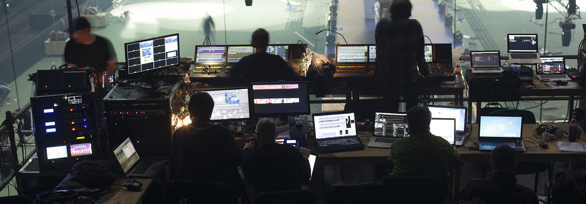 Event production management team coordinating staging, show flow, and technical readiness